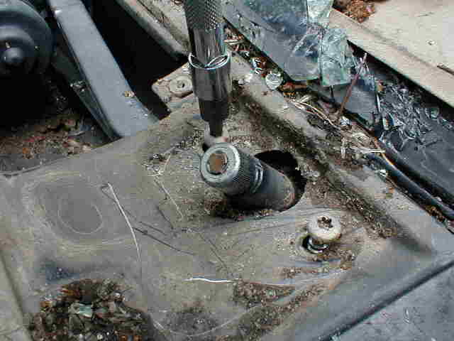 Torx bolts holding cover to arm pivots