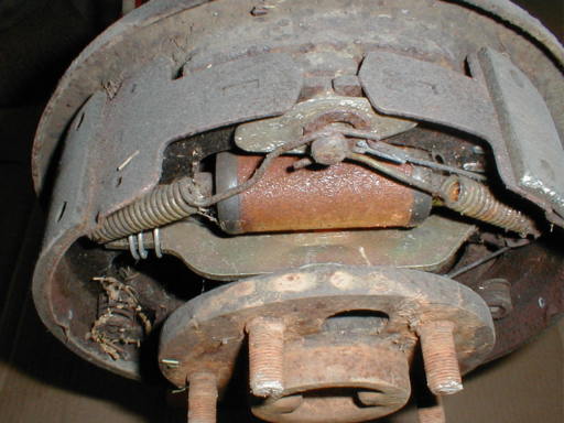 Image shows Jeep Dana 44 wheel cylinder, spring anchor pin & springs.